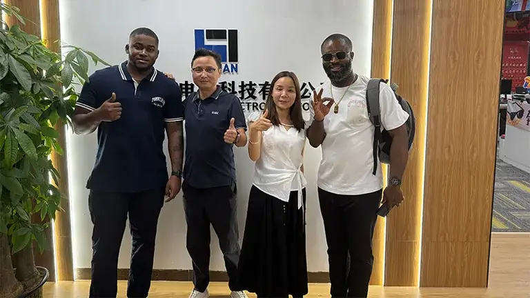 Fijian customer delegation giving thumbs up at Ruihan Energy company headquarters